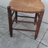 Vintage low stool with straw seat