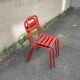 2 red metal Tolix-style chairs, France 1950