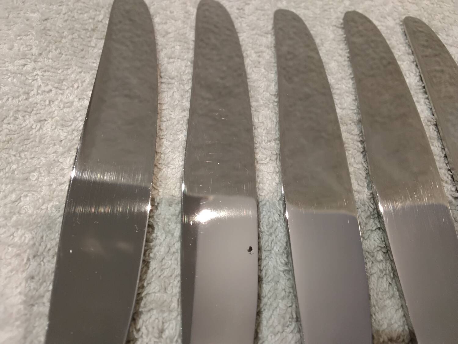 12 silver-plated dessert knives by St Medard, rocaille style, Florian.