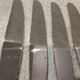 12 silver-plated dessert knives by St Medard, rocaille style, Florian.
