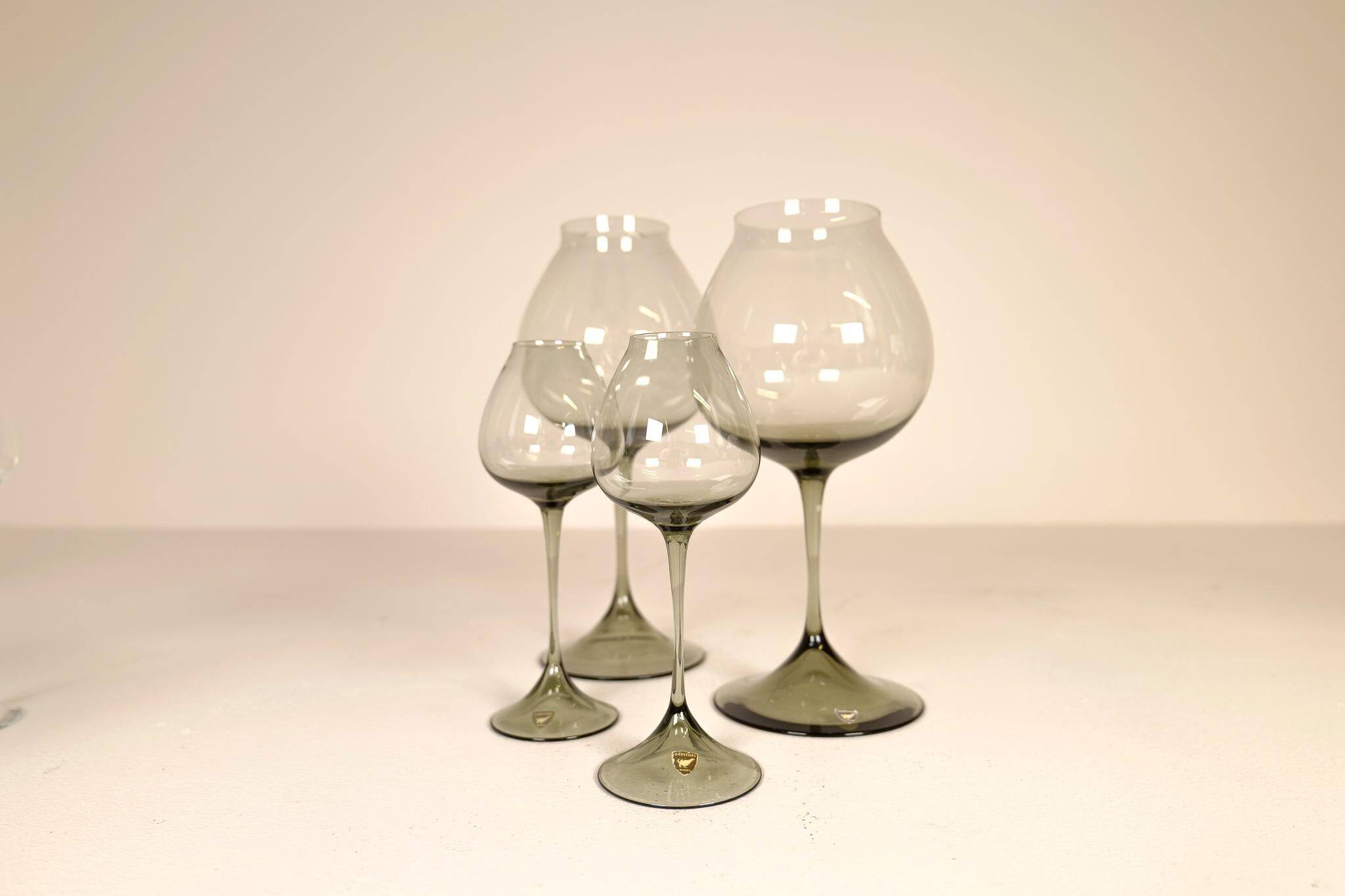 Large collection of Midcentury tulip glasses by Orrefors Nils Landberg, Sweden, 1950s.