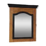 Black mirror and raw natural wood