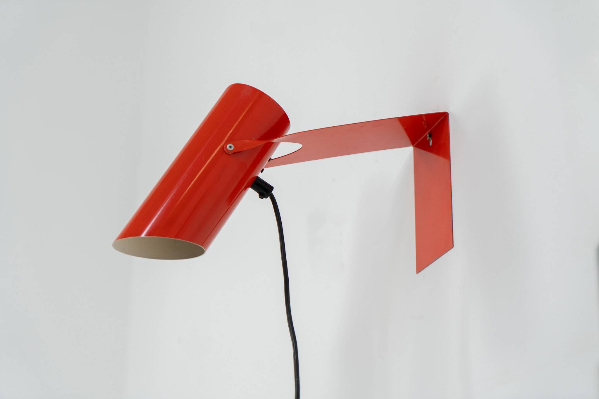 Pair of red metal wall lights
