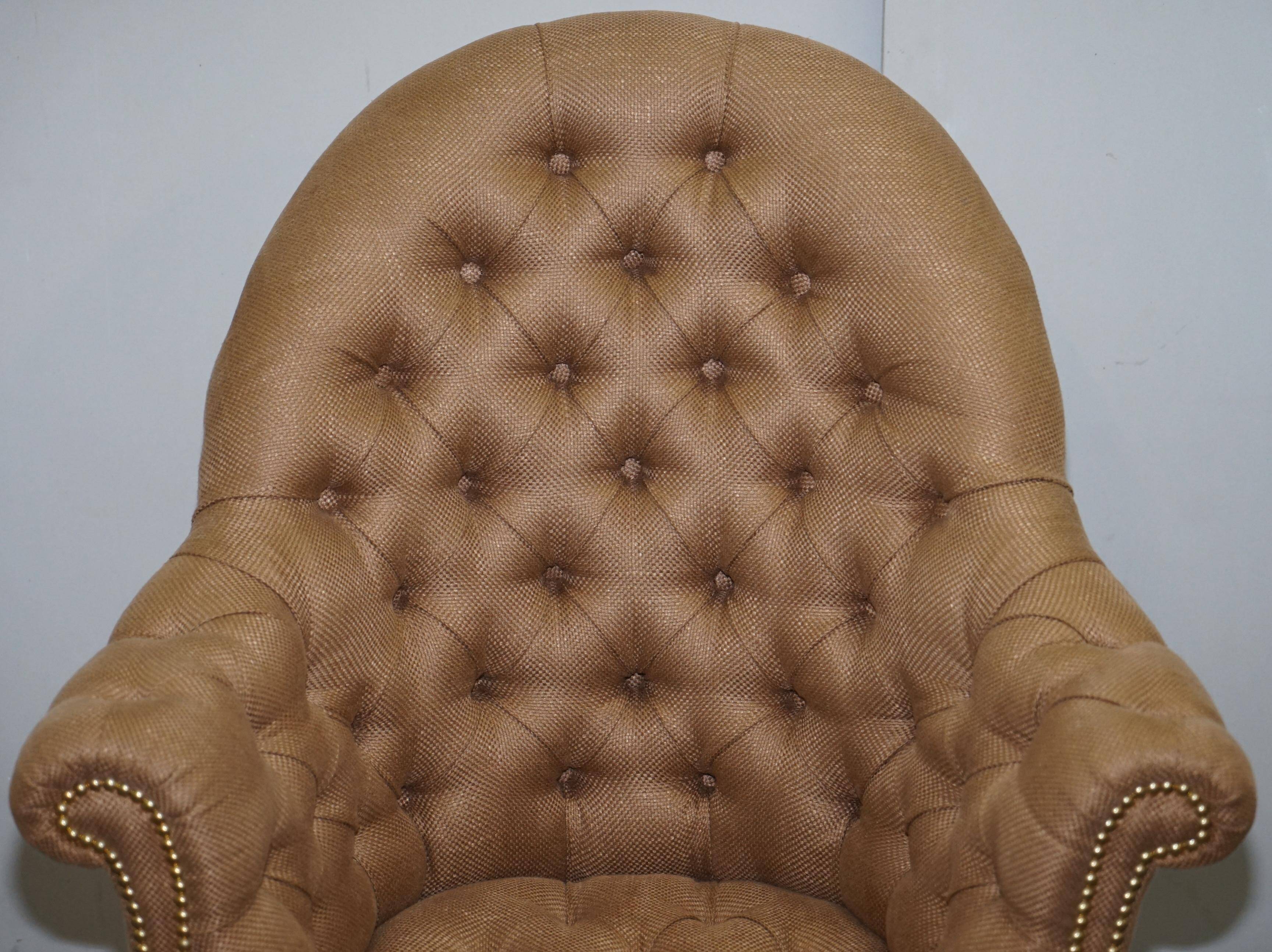 Chesterfield armchair in hardwood, leather, and woven linen.