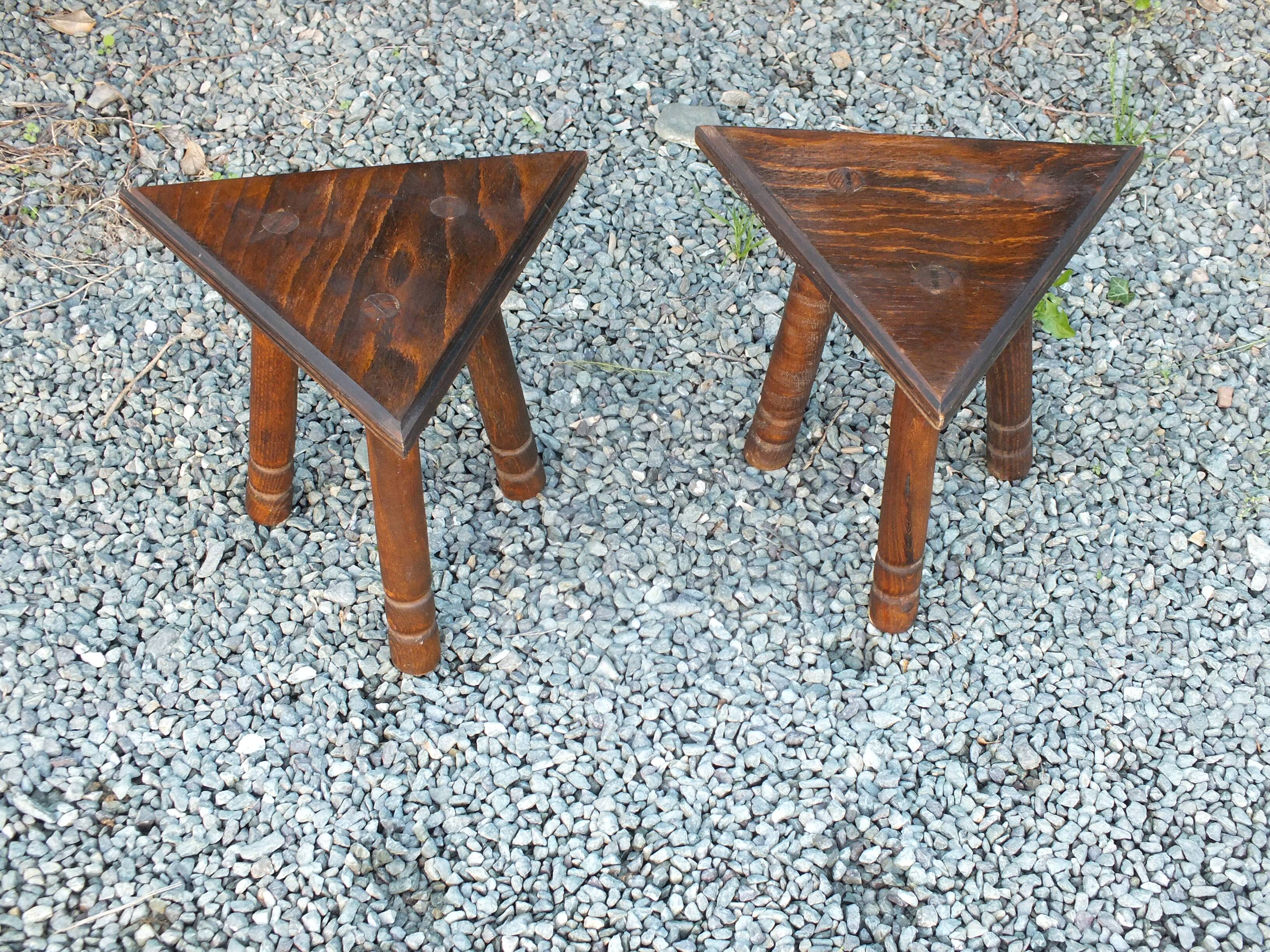Pair of triangular turned wood stools or harnesses