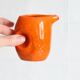 Petit pichet en céramique orange des années 70