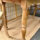 Round oak table with a drop leaf.