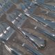 12 silver-plated oyster forks, 13.3cm contours