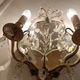 Pair of mirror sconces with two arms of light with gilded brass grapevines, Italy 1960.