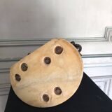 Three musician angels, bronze sculptures on a marble base.