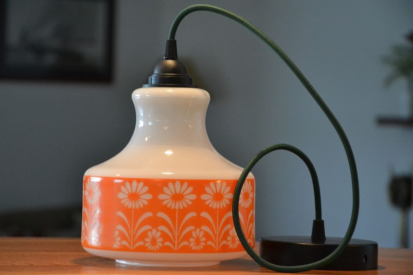 Seventies chandelier in white opaline decorating orange flowers