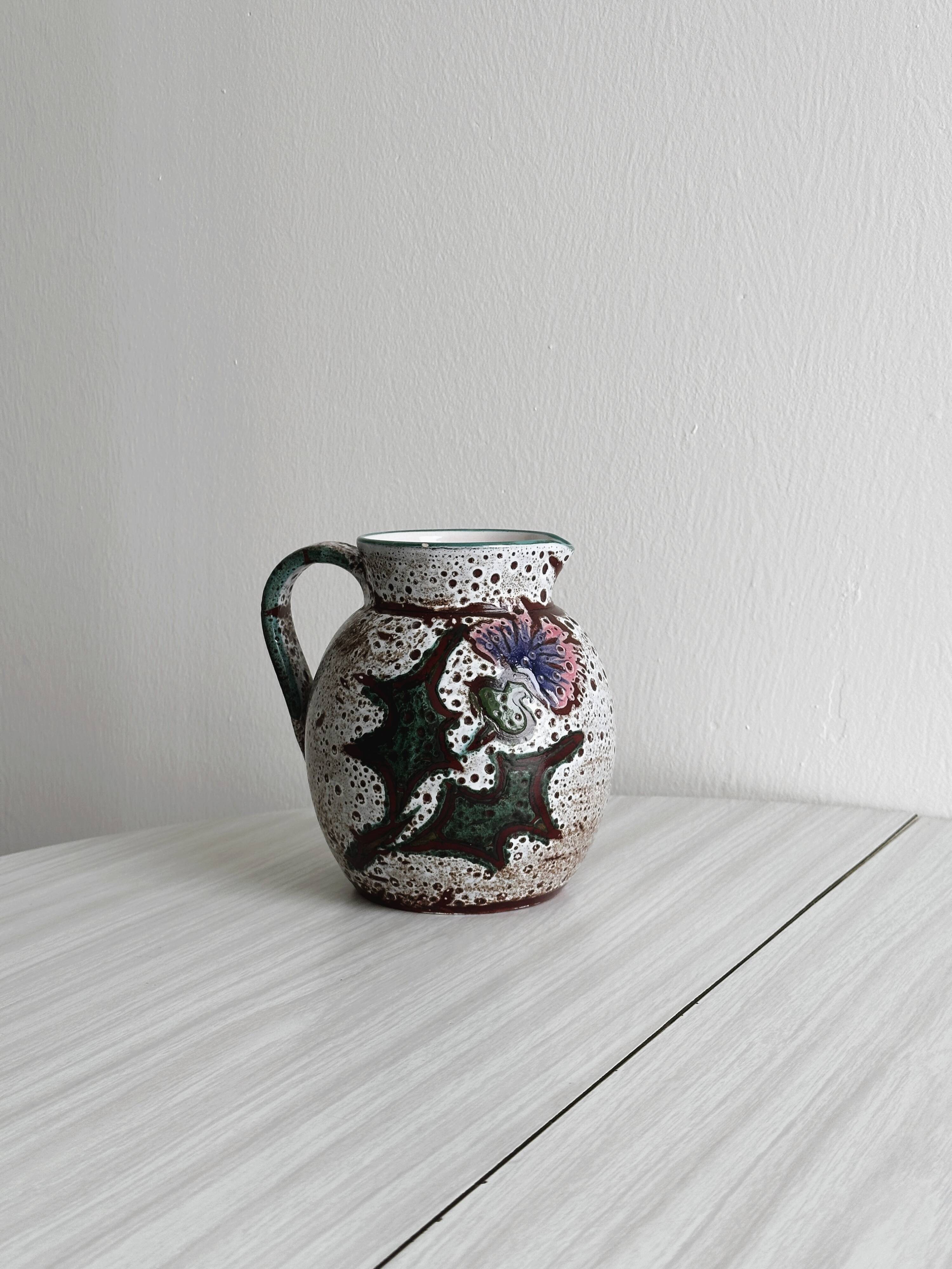 Antique decorative ceramic pitcher