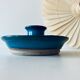 Blue enamelled sandstone candlestick