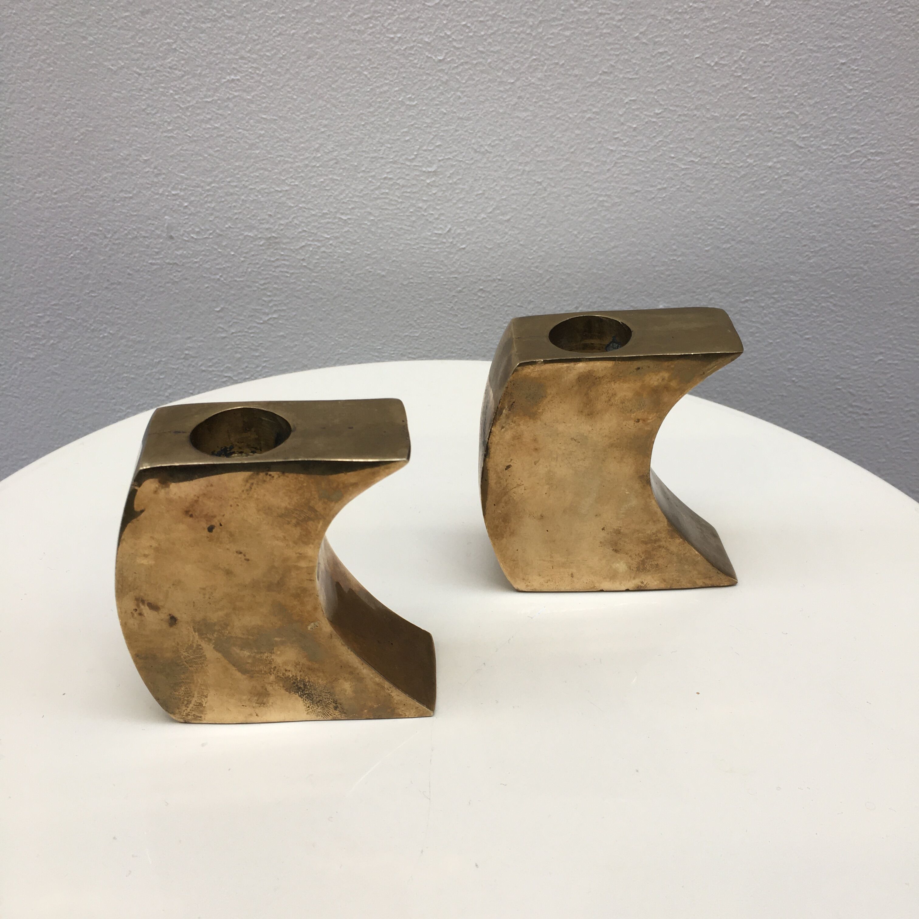 Pair of bronze candle holders by Monique Gerber