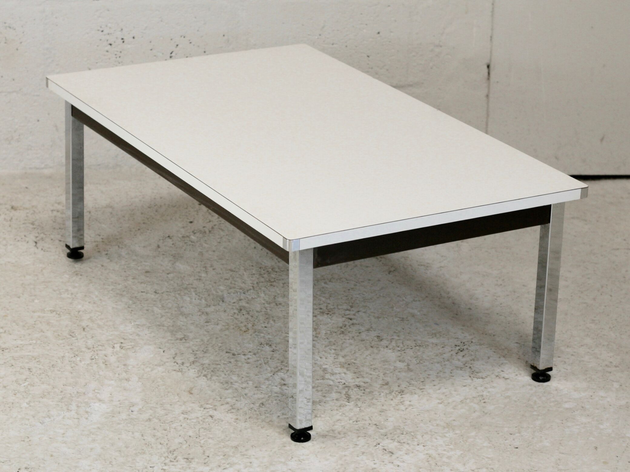 Coffee table chrome steel base, white melaminate top. France, circa 1970.