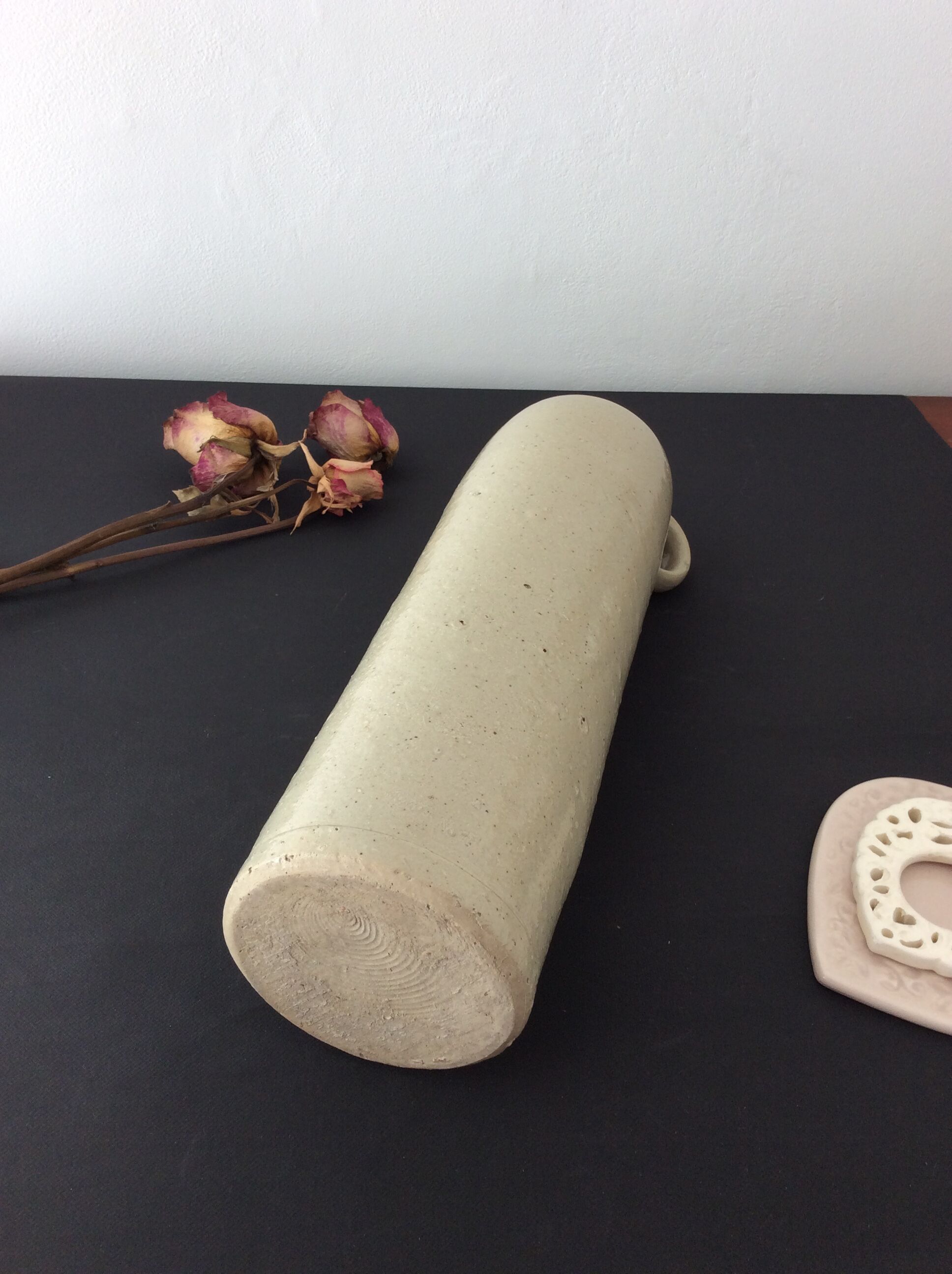 Old stoneware bottle with ear, loop