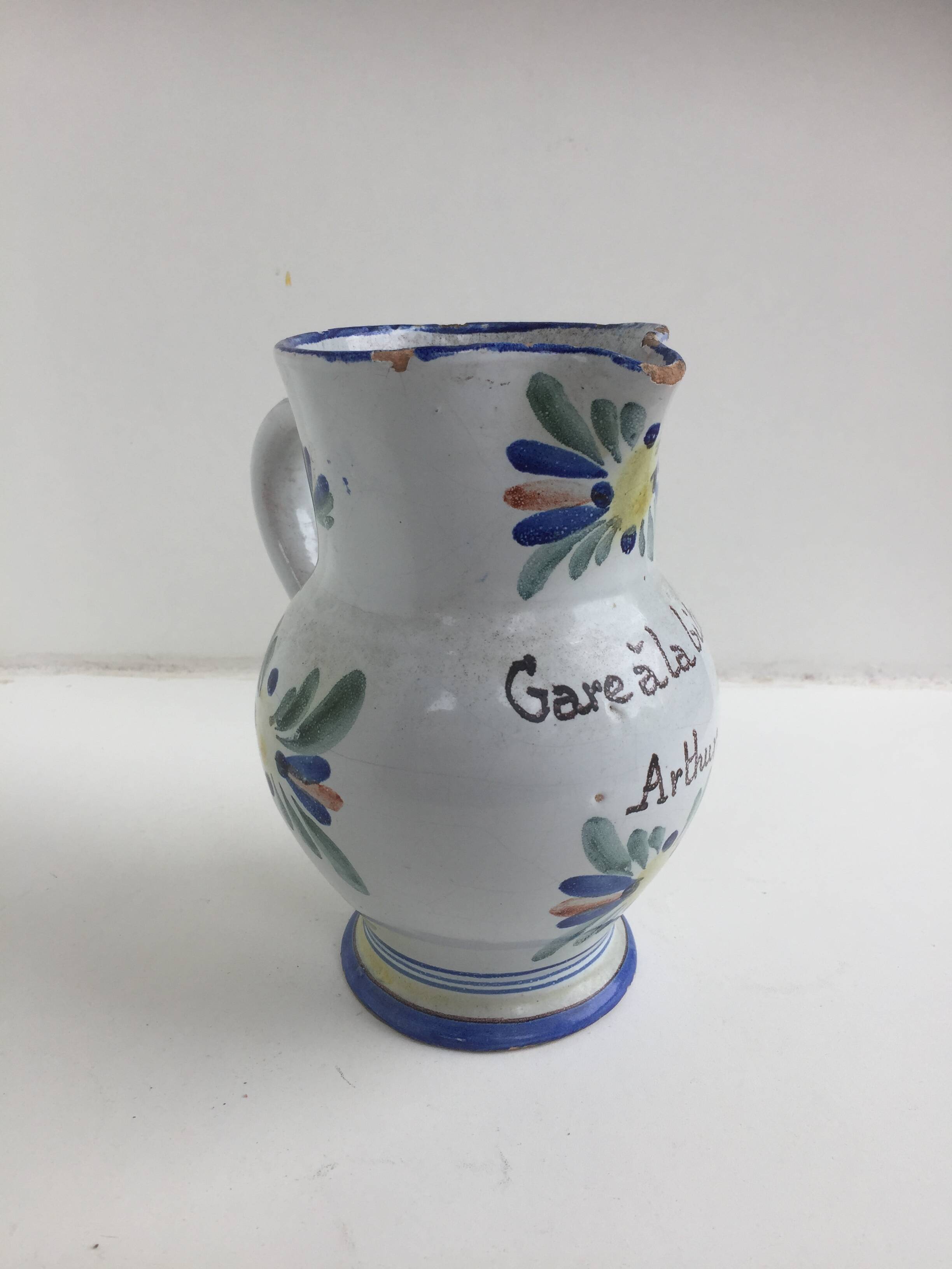 Old earthenware pitcher Beware at the Arthur biture