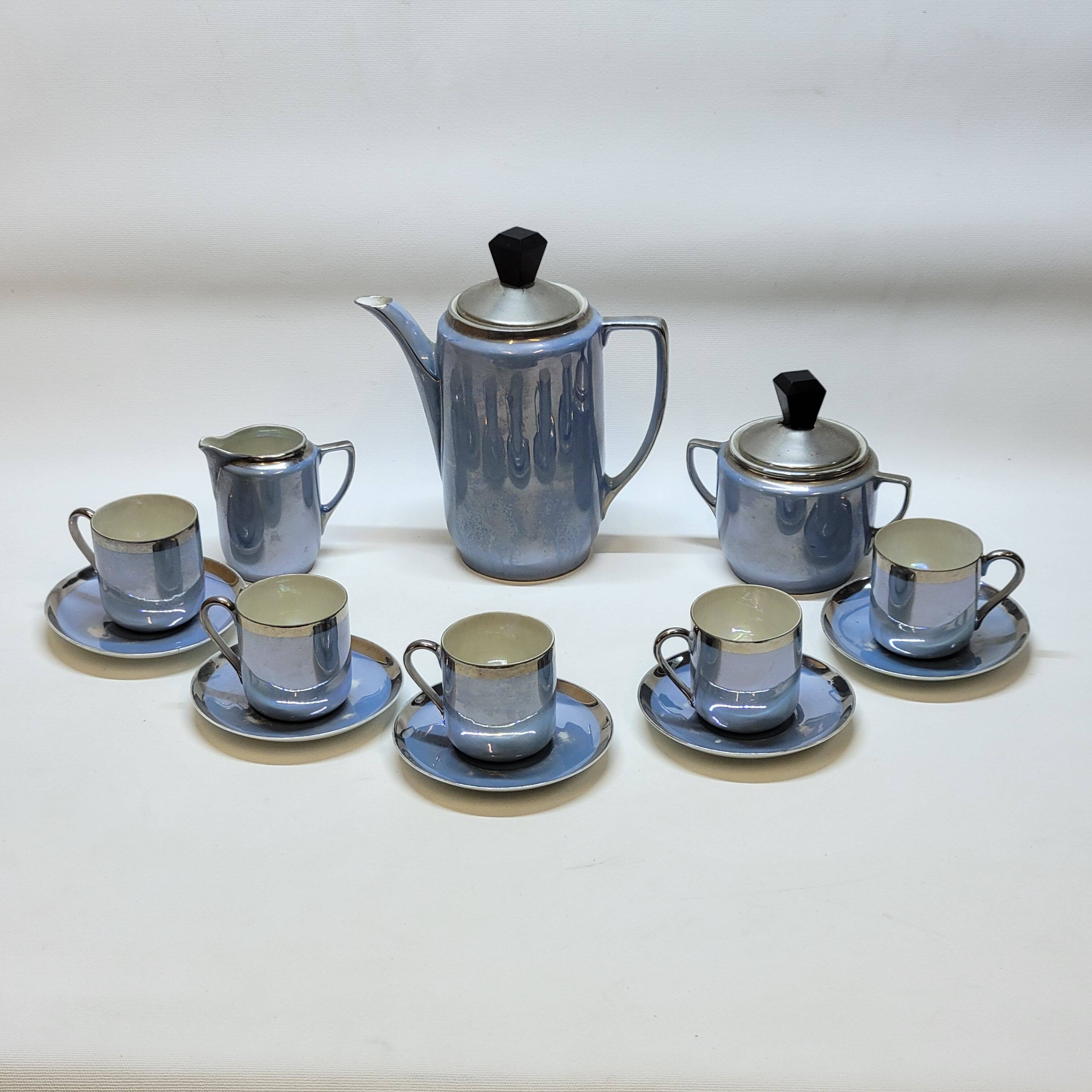 Art deco coffee service in fine iridescent blue porcelain, metal and wood