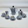 Art deco coffee service in fine iridescent blue porcelain, metal and wood