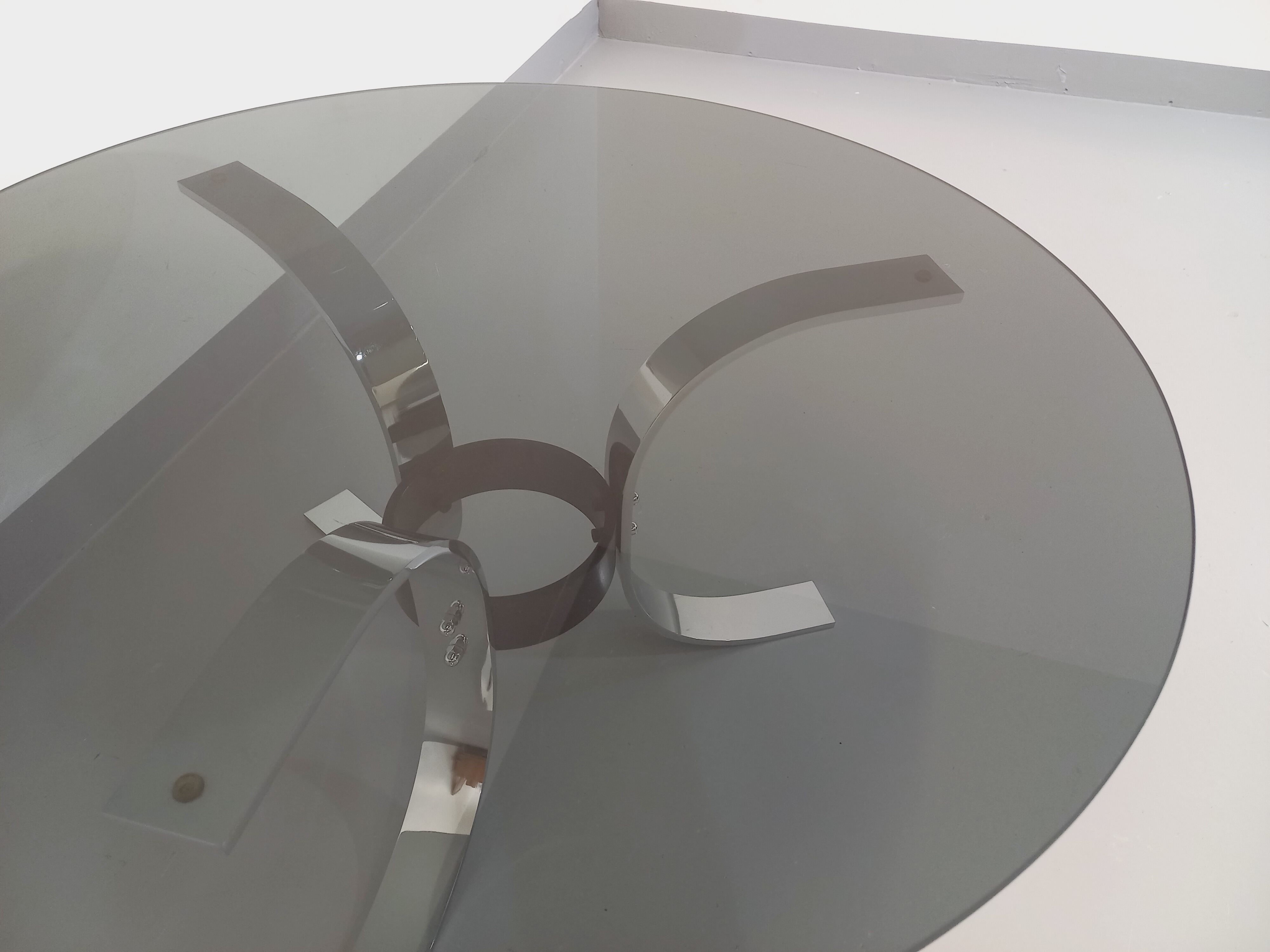 Vintage round coffee table in glass, chromed metal and black metal Space Age style of the 70s
