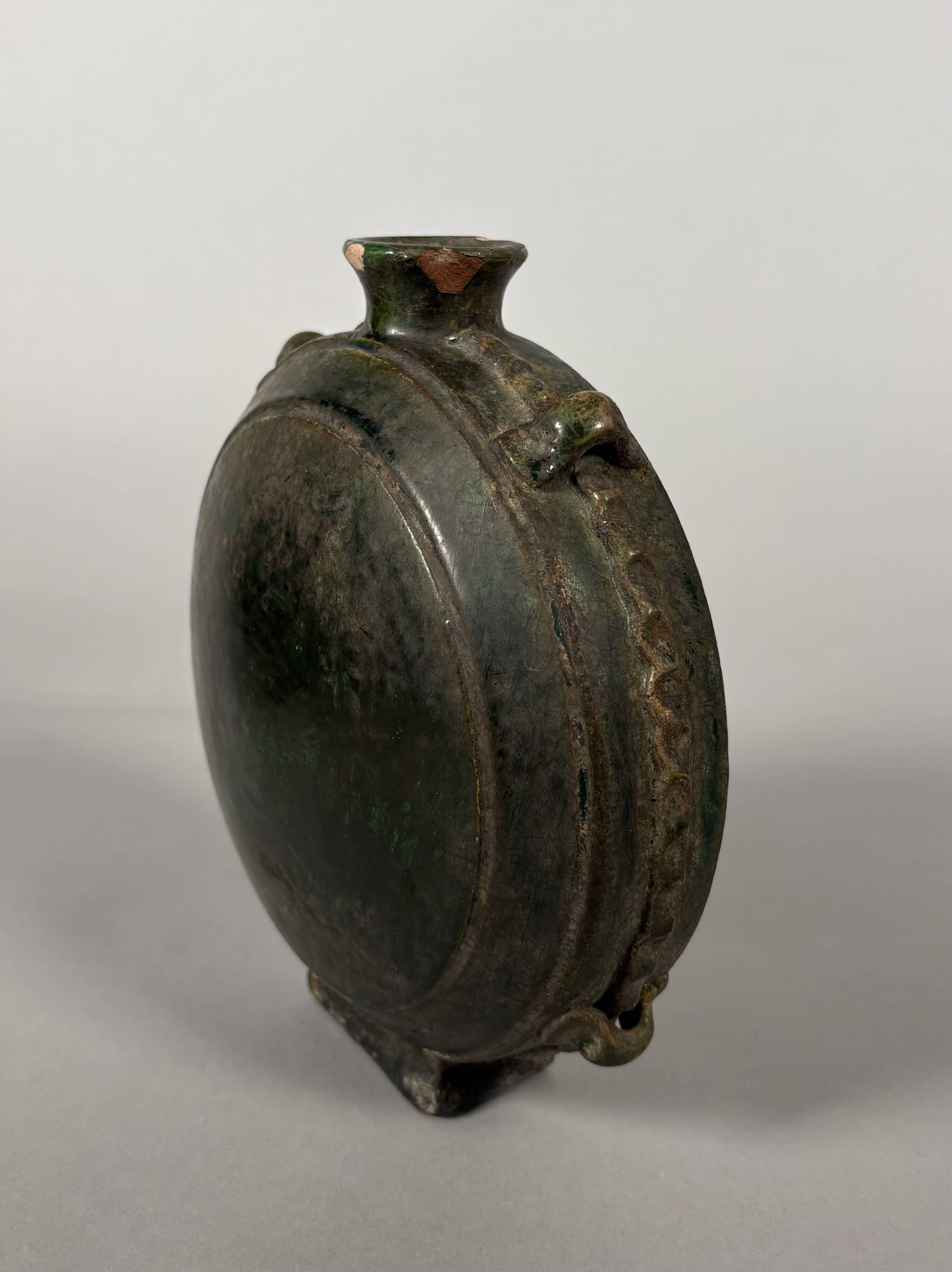 Nomadic rider's jug in green glazed earthenware, China, Tang Dynasty.