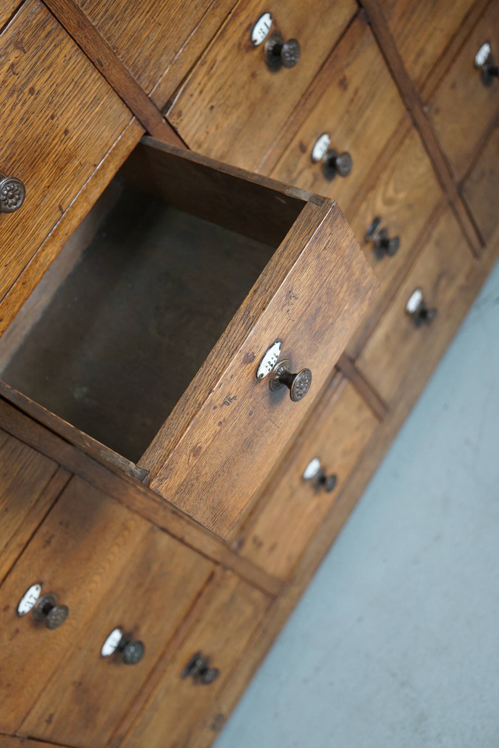 Large dutch oak apothecary cabinet / barber cabinet with enamel shields, 1900s