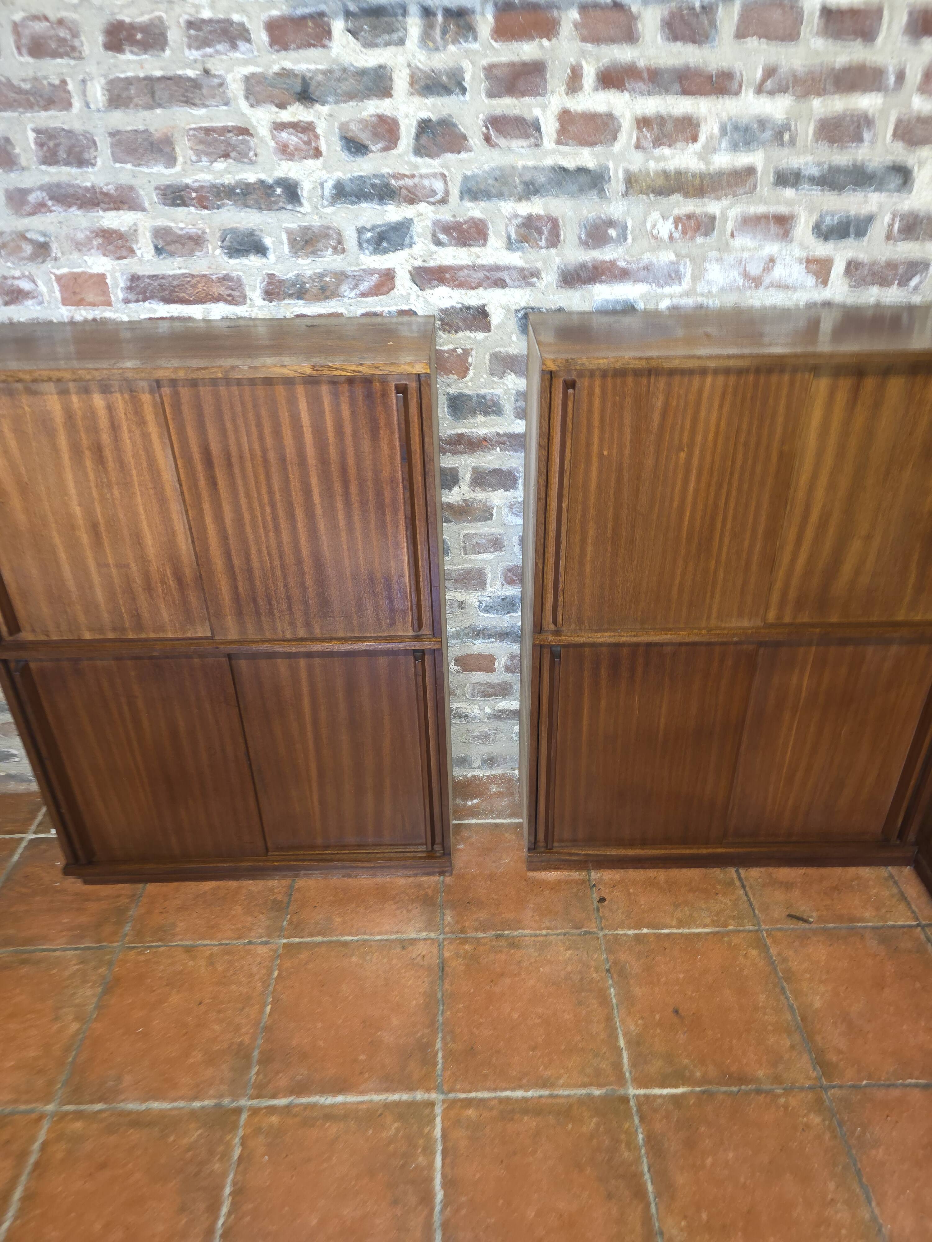 Modular corner library Oscar from the 1960s with sliding doors.