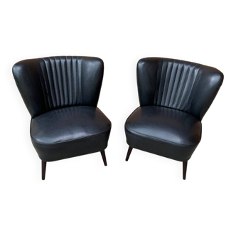 Pair of black cocktail chairs in beech and vinyl, Mid-Century style, 1950s.