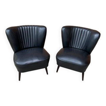 Pair of black cocktail chairs in beech and vinyl, Mid-Century style, 1950s.