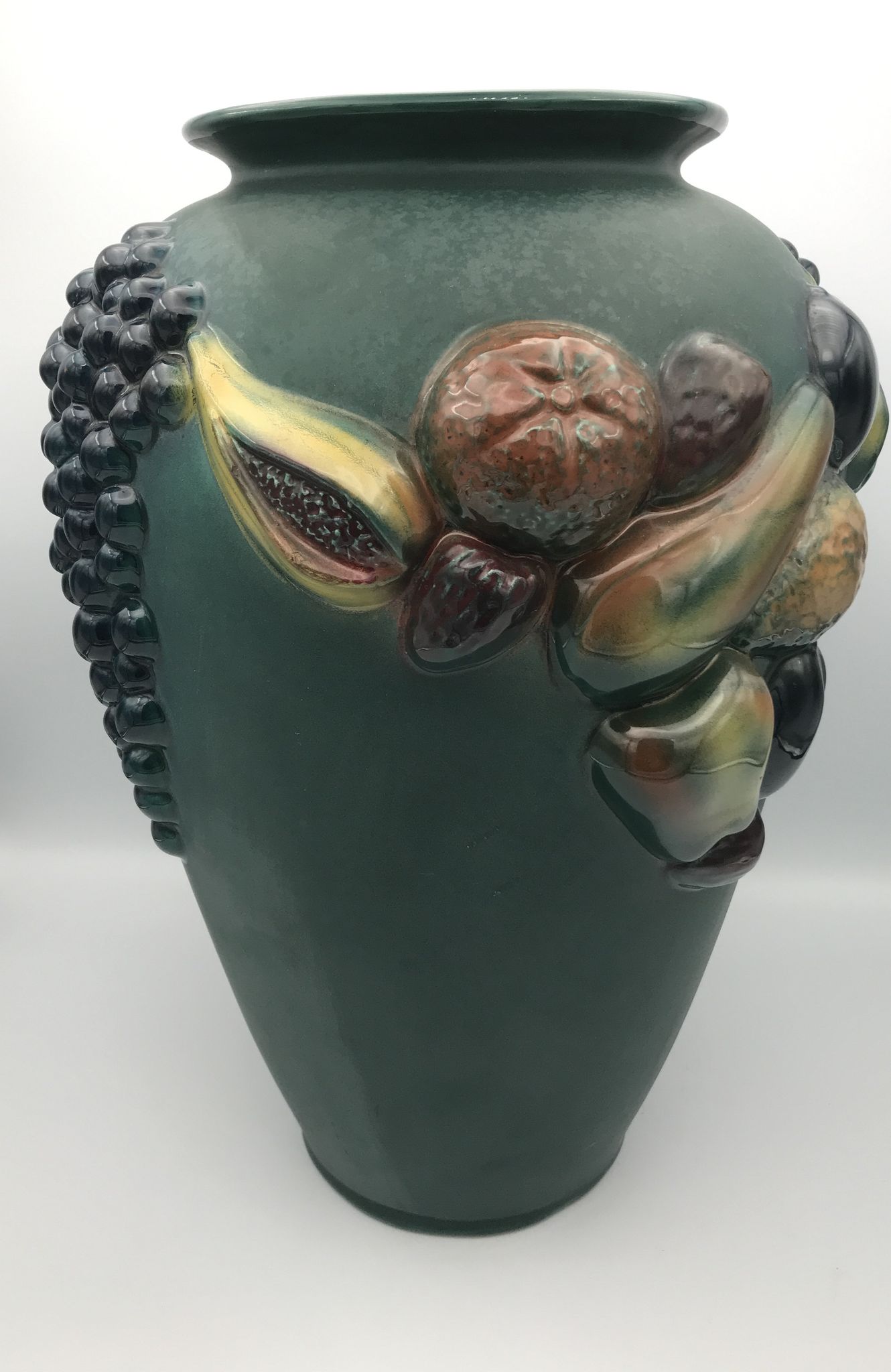 Green ceramic vase with polychrome decoration of fruits and vegetables in relief 33.5 cm