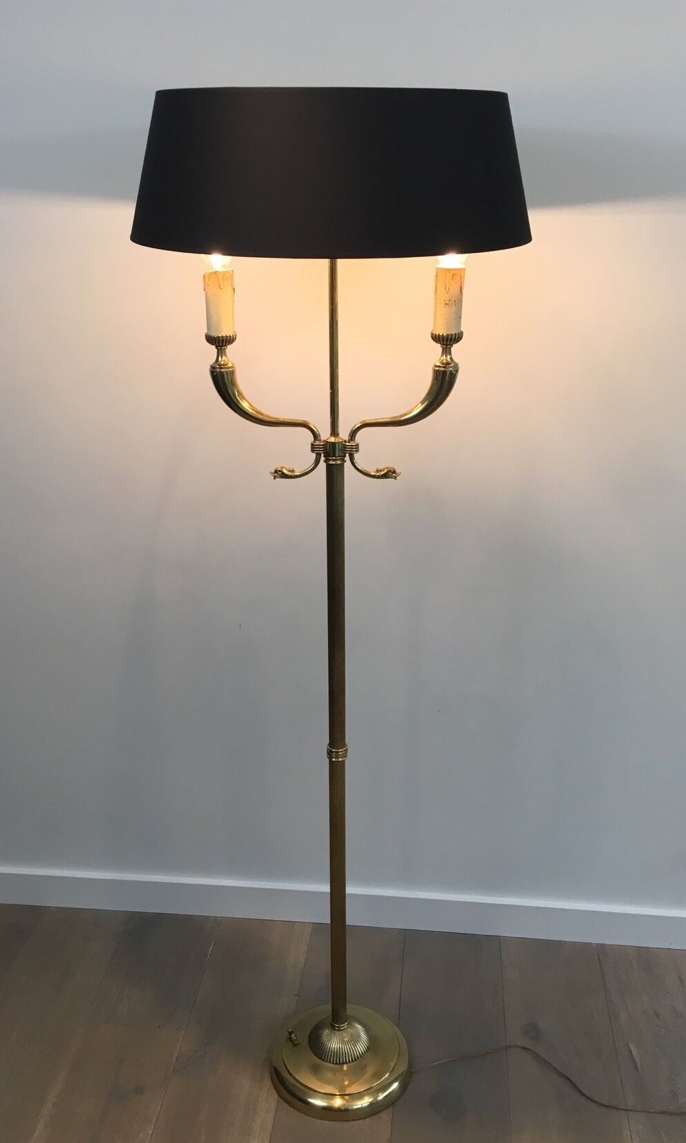Floor lamp of parquet in neoclassical style in brass with dolphin heads