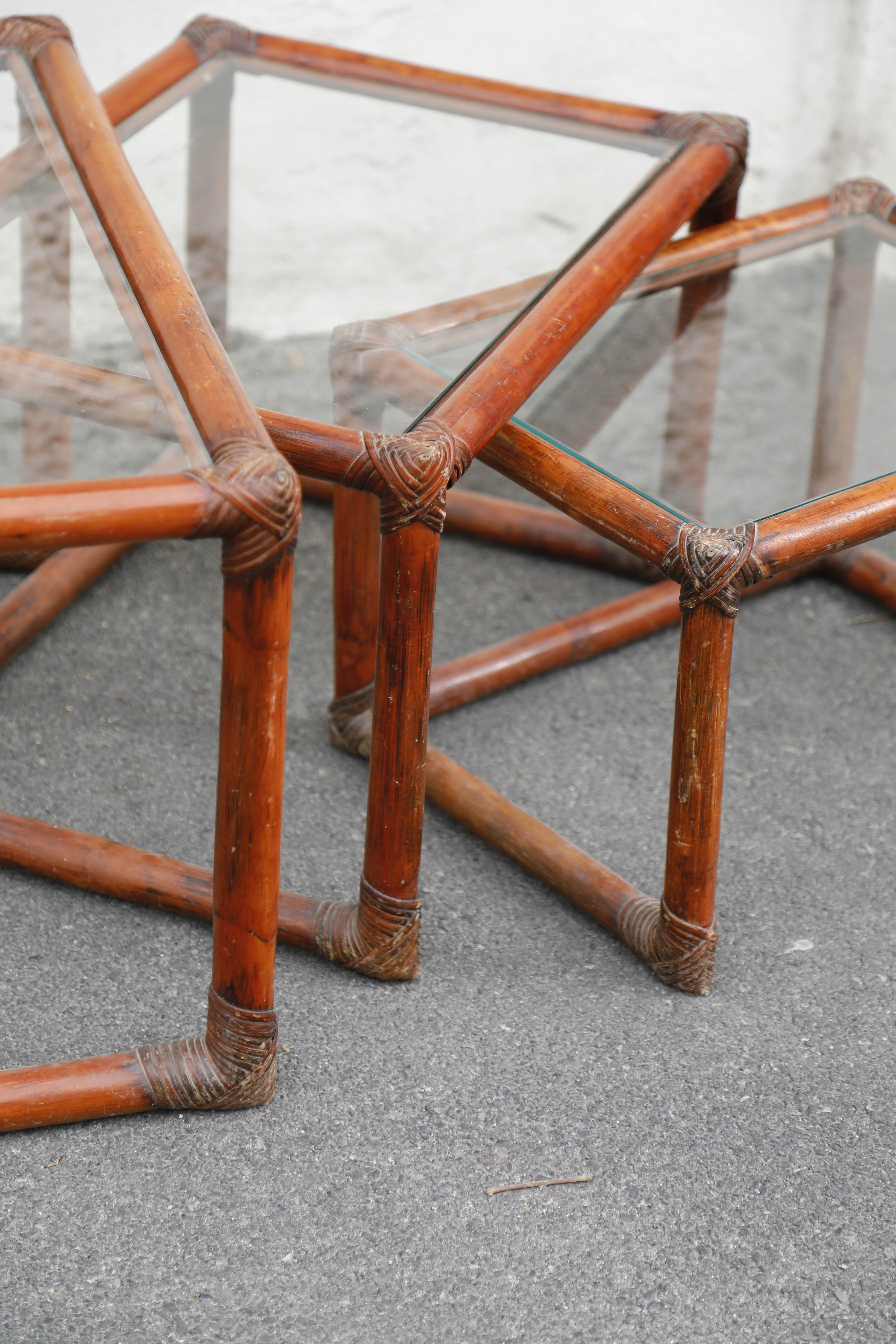 Rattan and glass side tables
