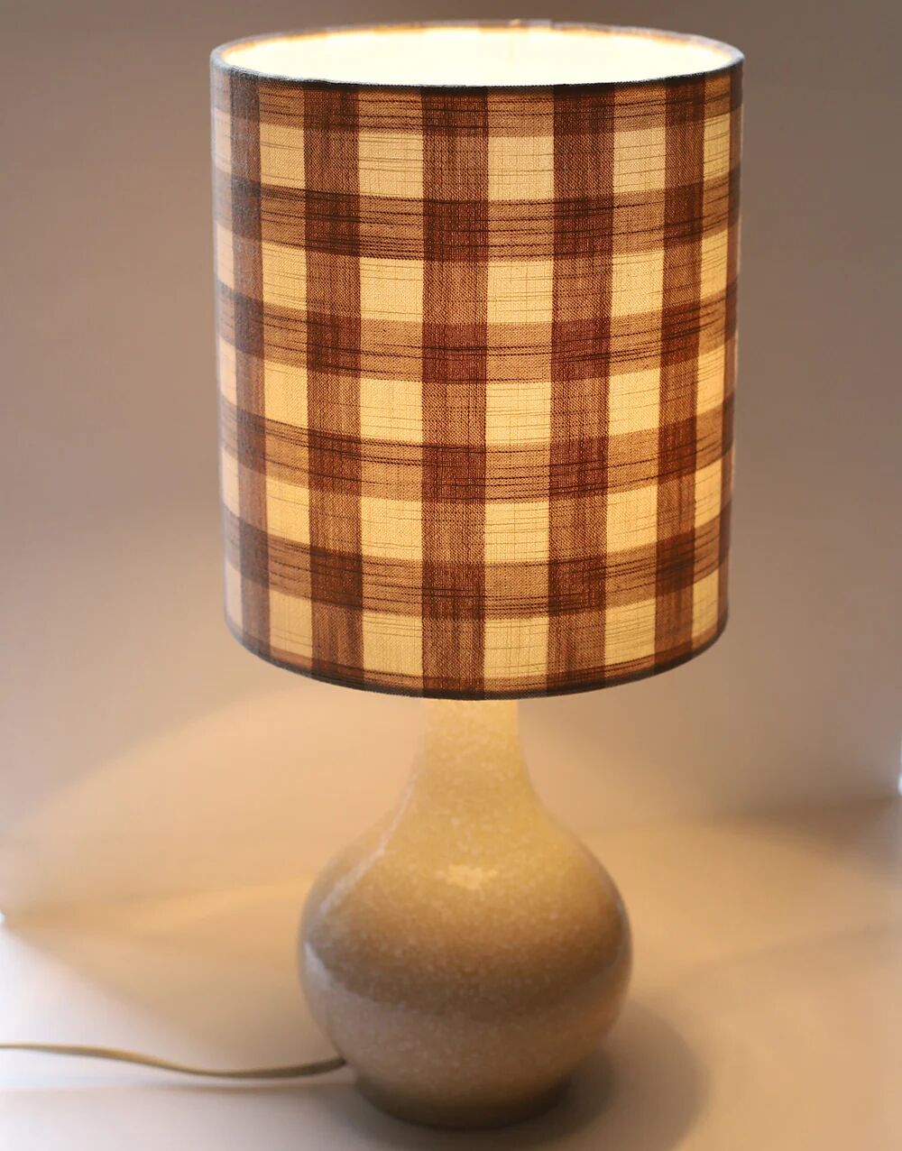 Vintage table lamp, 1950s ceramic base and beige gingham shade.