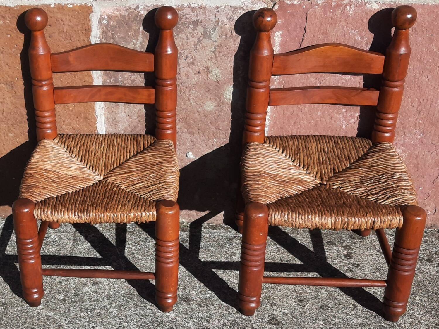 Pair of low armchairs by the fireplace. (Straw seat)