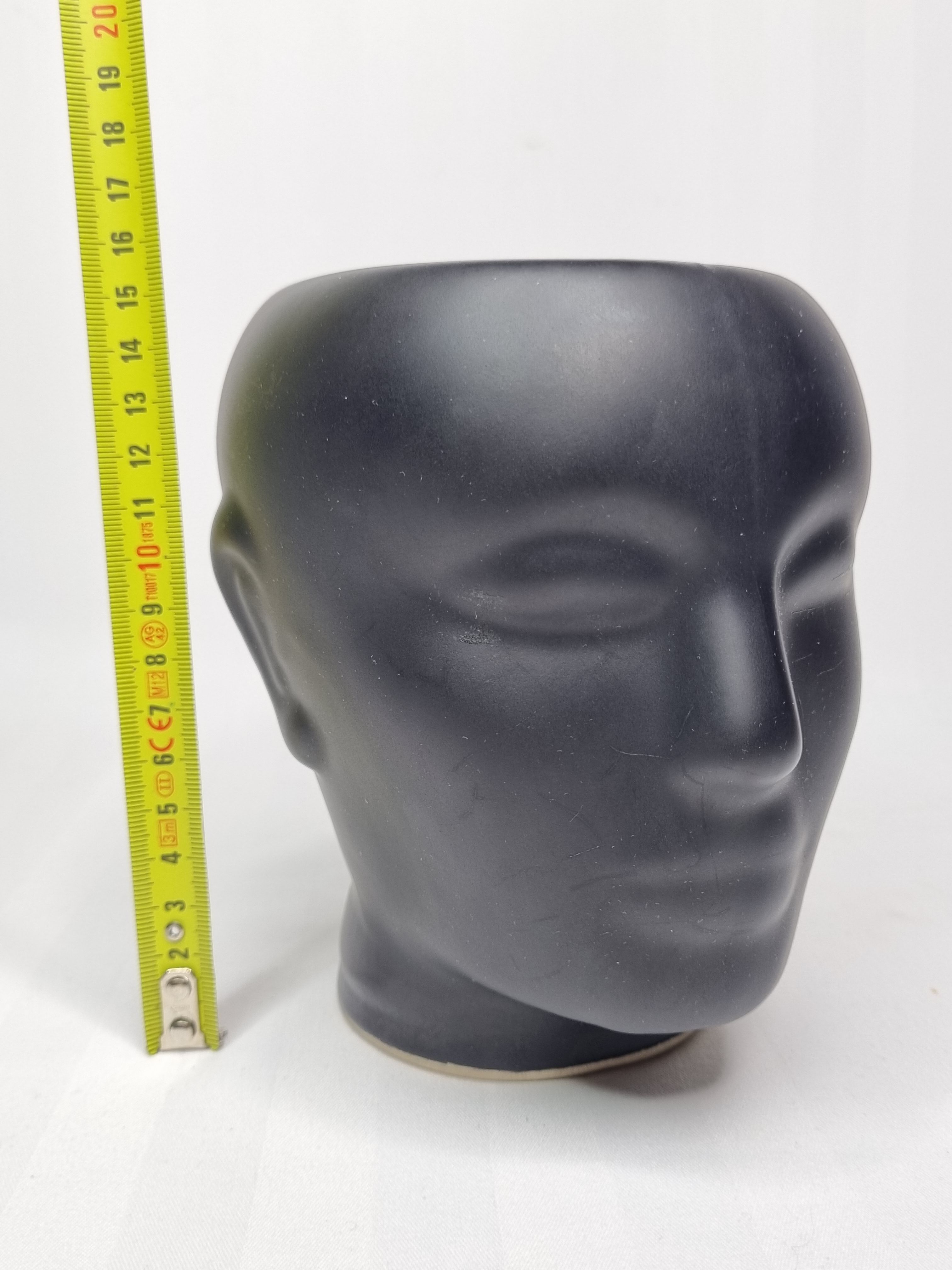 Anthropomorphic pot cover in matt black glazed ceramic, 80s