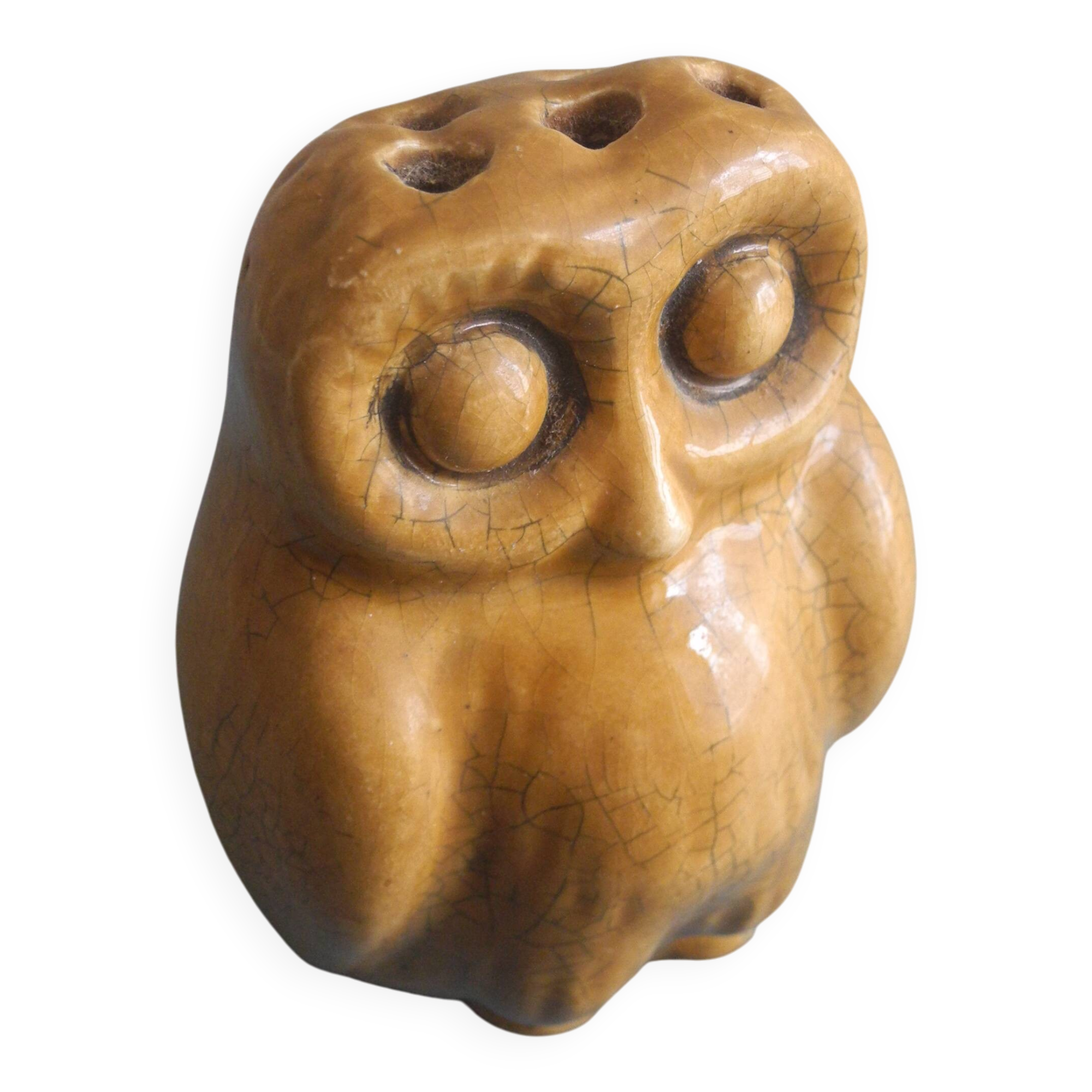 vintage earthenware vase with an old flower pick and an owl decoration