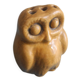 vintage earthenware vase with an old flower pick and an owl decoration