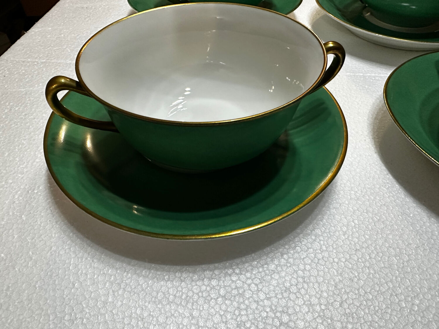 Service 14 cup and saucer in Art Deco Emerald Green and Gold.