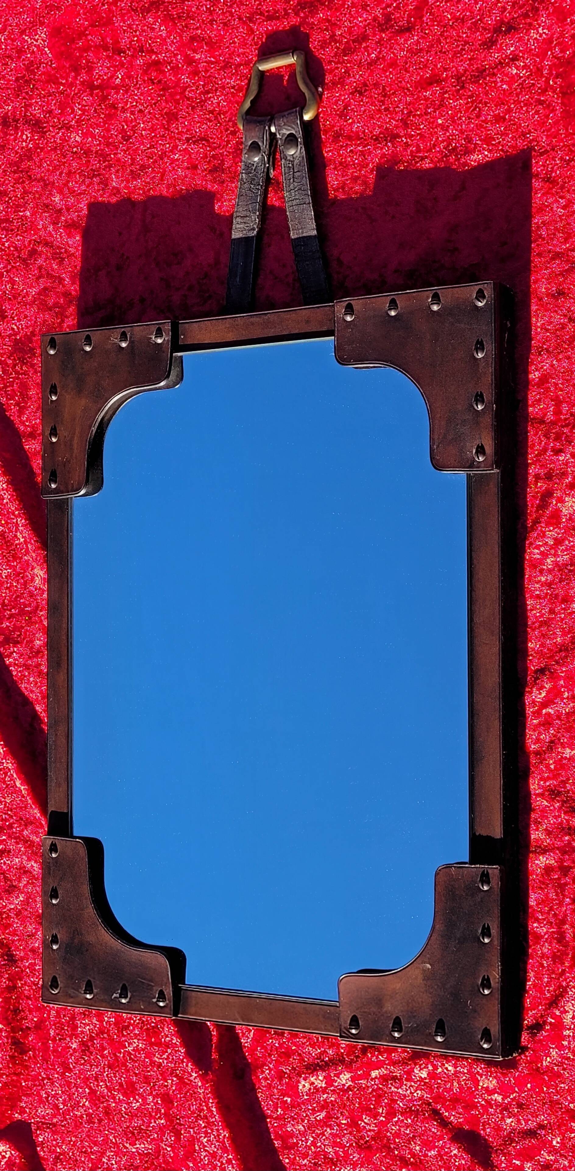 Leather-covered wall mirror attributed to Jacques Adnet 1950