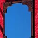 Leather-covered wall mirror attributed to Jacques Adnet 1950