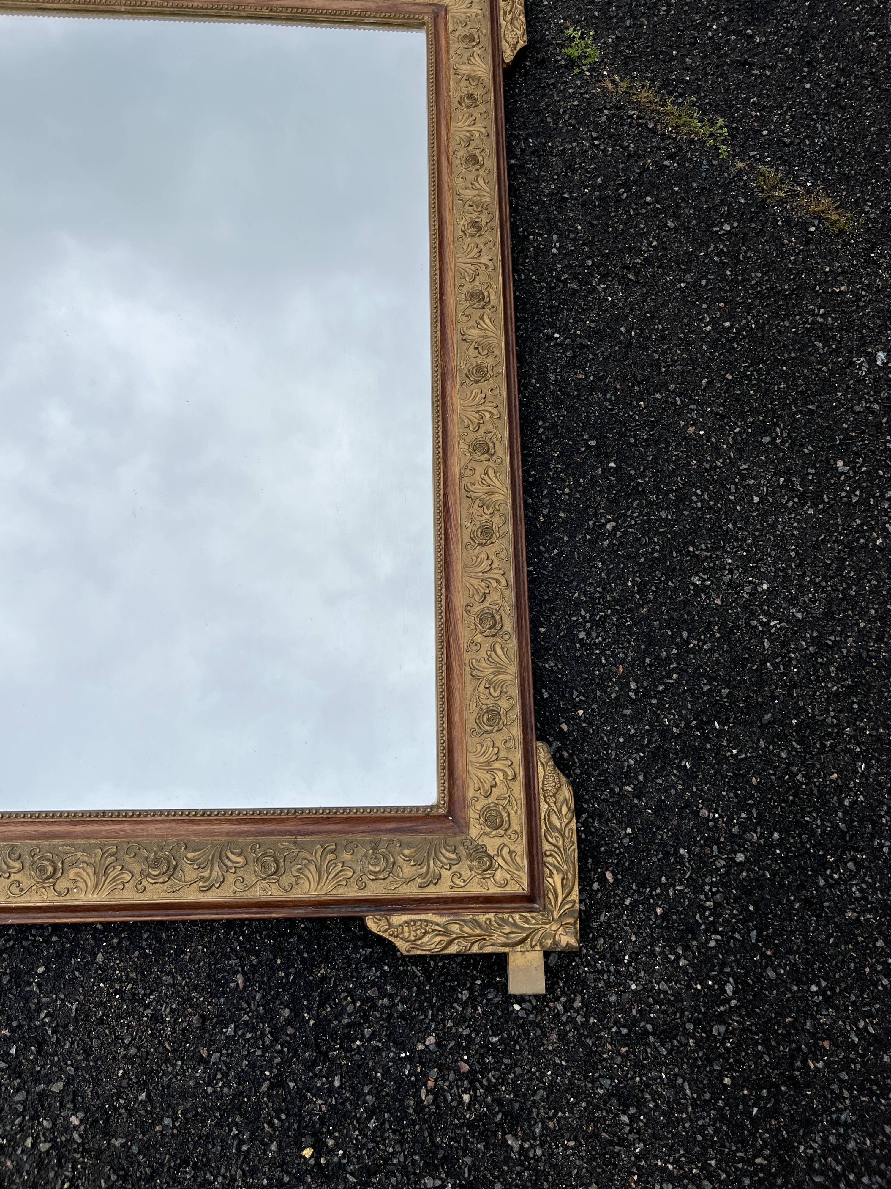 Large gold mirror in Louis XVI style with laurel crown, 121 cm.