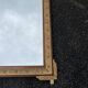 Large gold mirror in Louis XVI style with laurel crown, 121 cm.