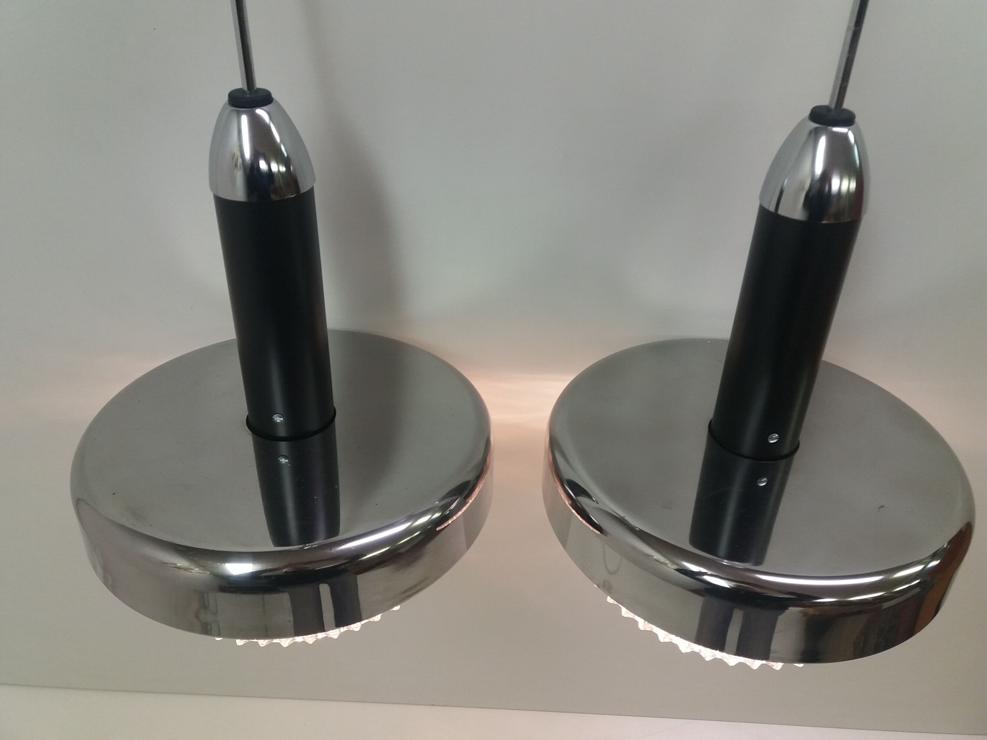 Pair of design metal chandeliers, Napako/UFO, 1970's.