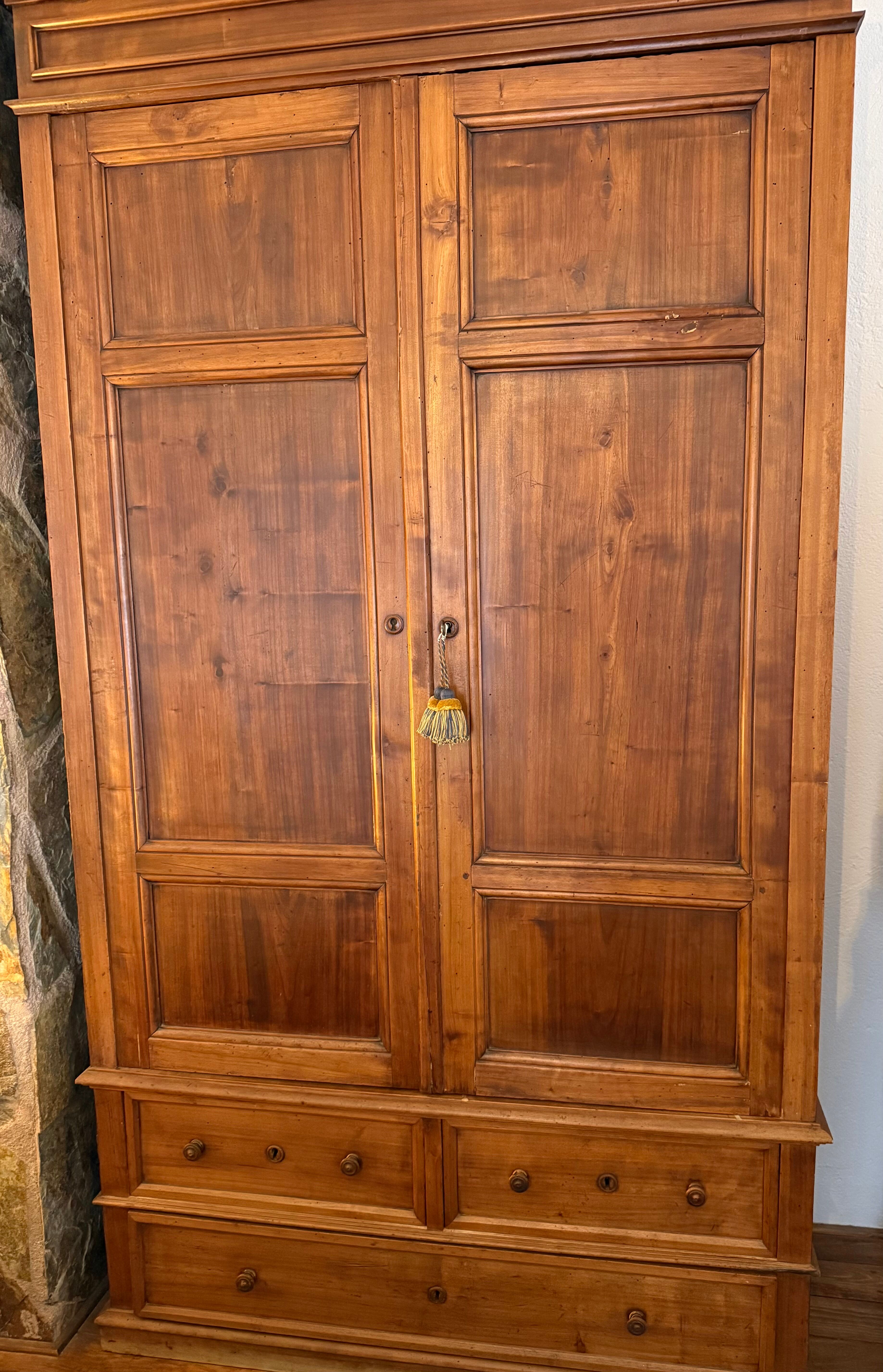 Antique solid wood wardrobe, rustic, with drawers and original key.