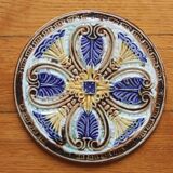 Dessous de bouteille / dessous de plat faïence en barbotine art nouveau fin XIXe début XXe