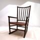 Fauteuil Manou en rotin et assise en cuir, 1960