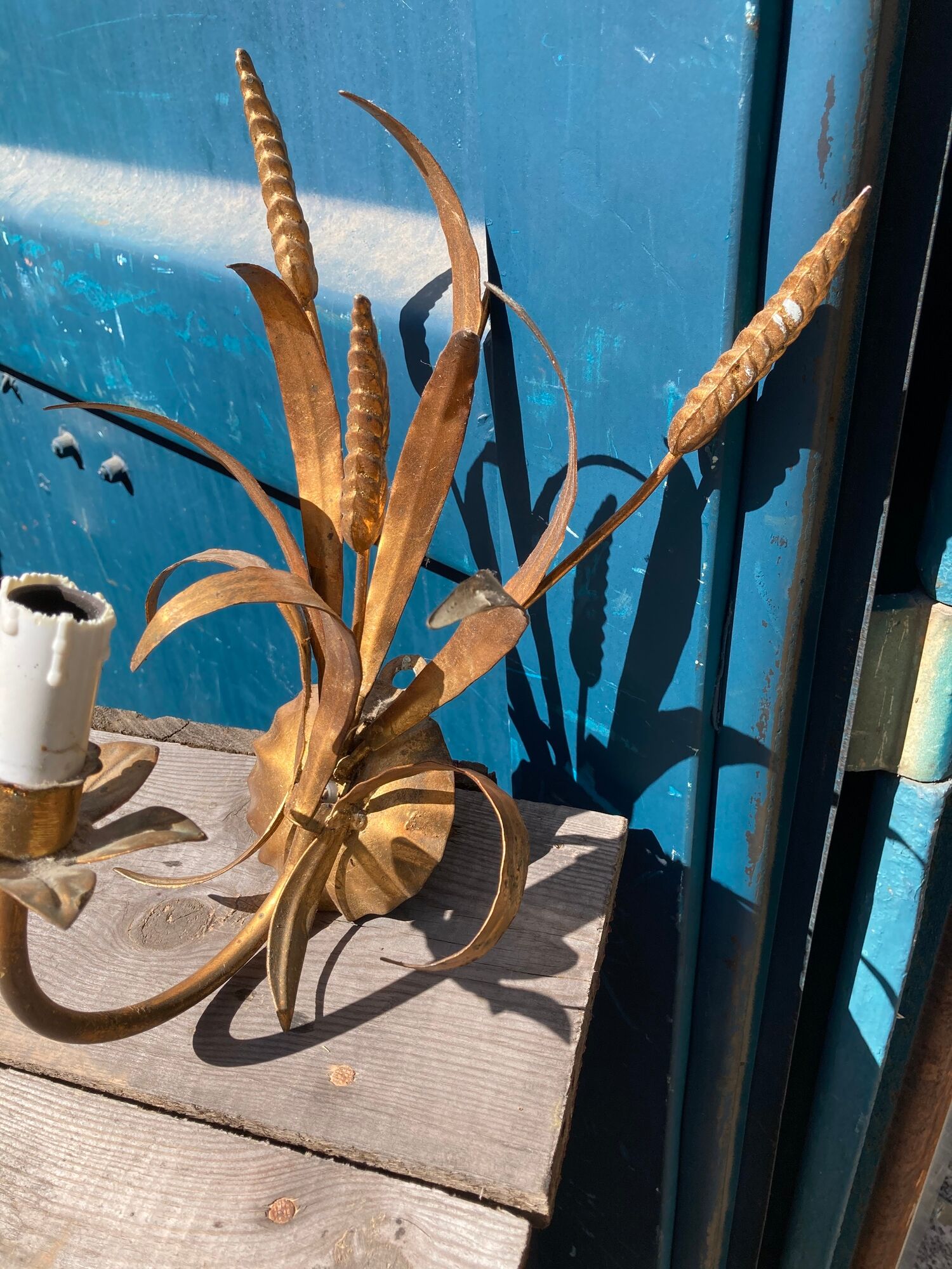 Pair of gold metal sconces decorated with wheat cob
