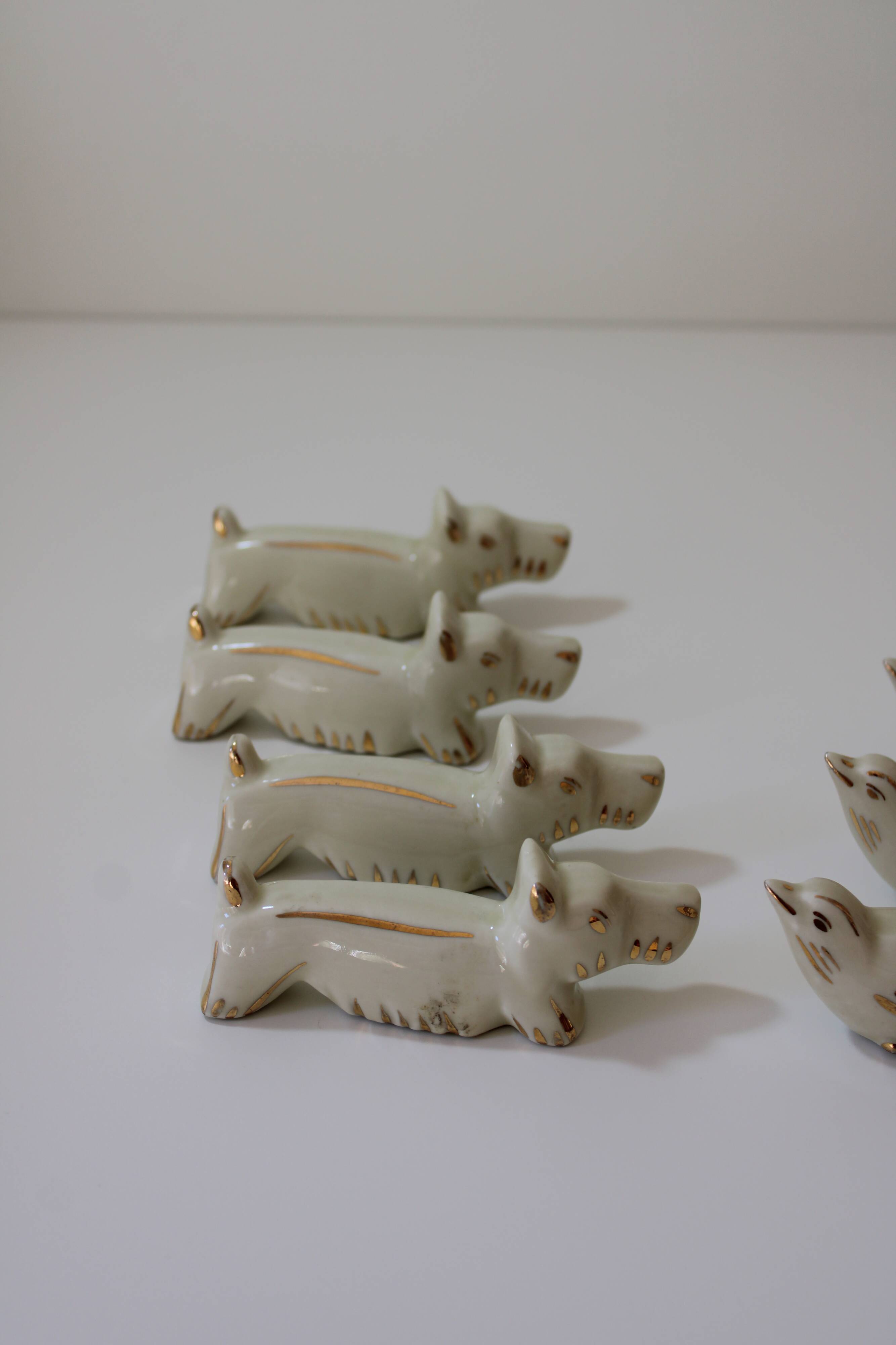 8 portes couteaux animaux porcelaine de Limoges vintage