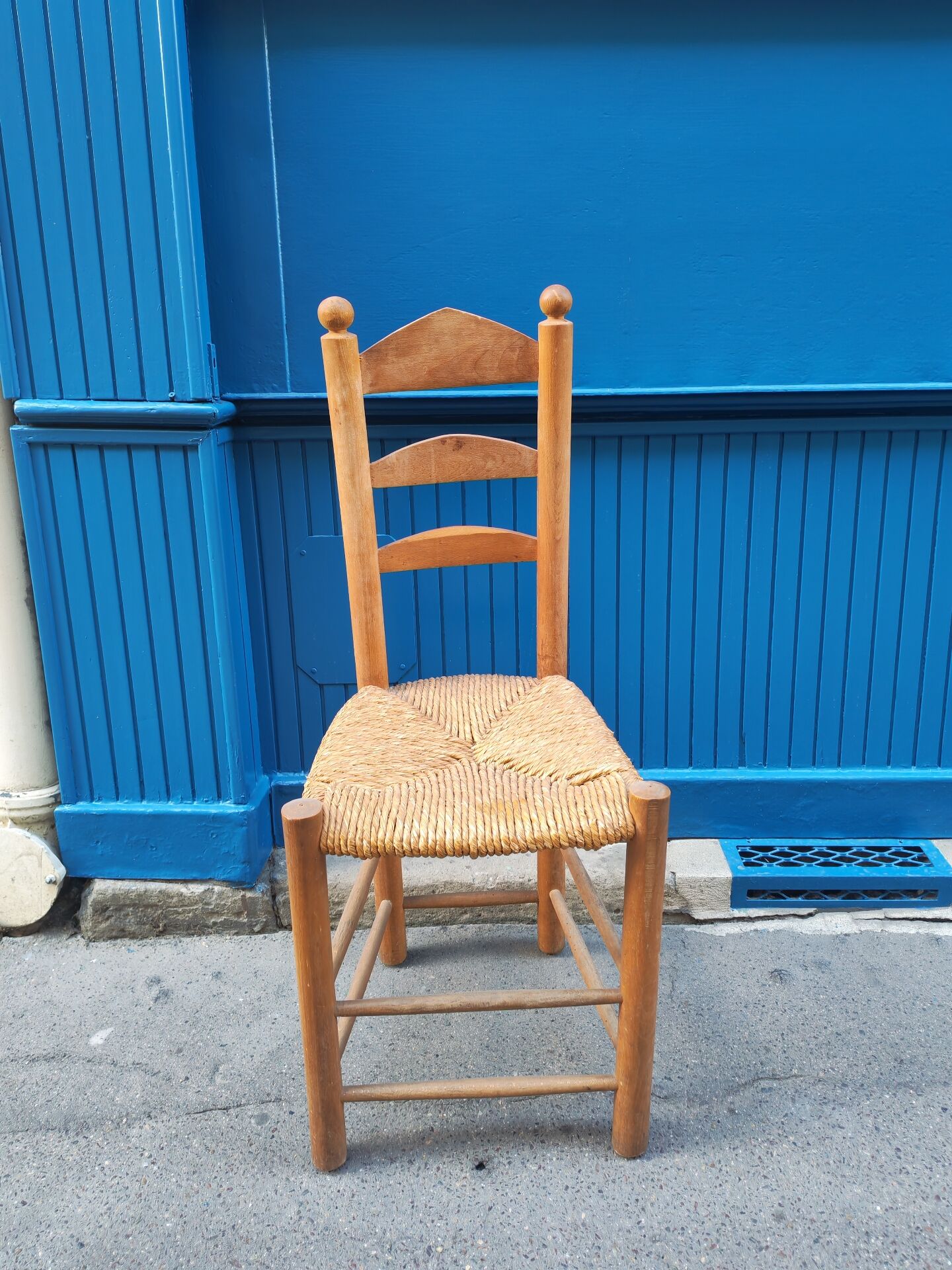 Neo-rustic chair in wood and wicker in the brutalist style by Charles Dudyoyut.