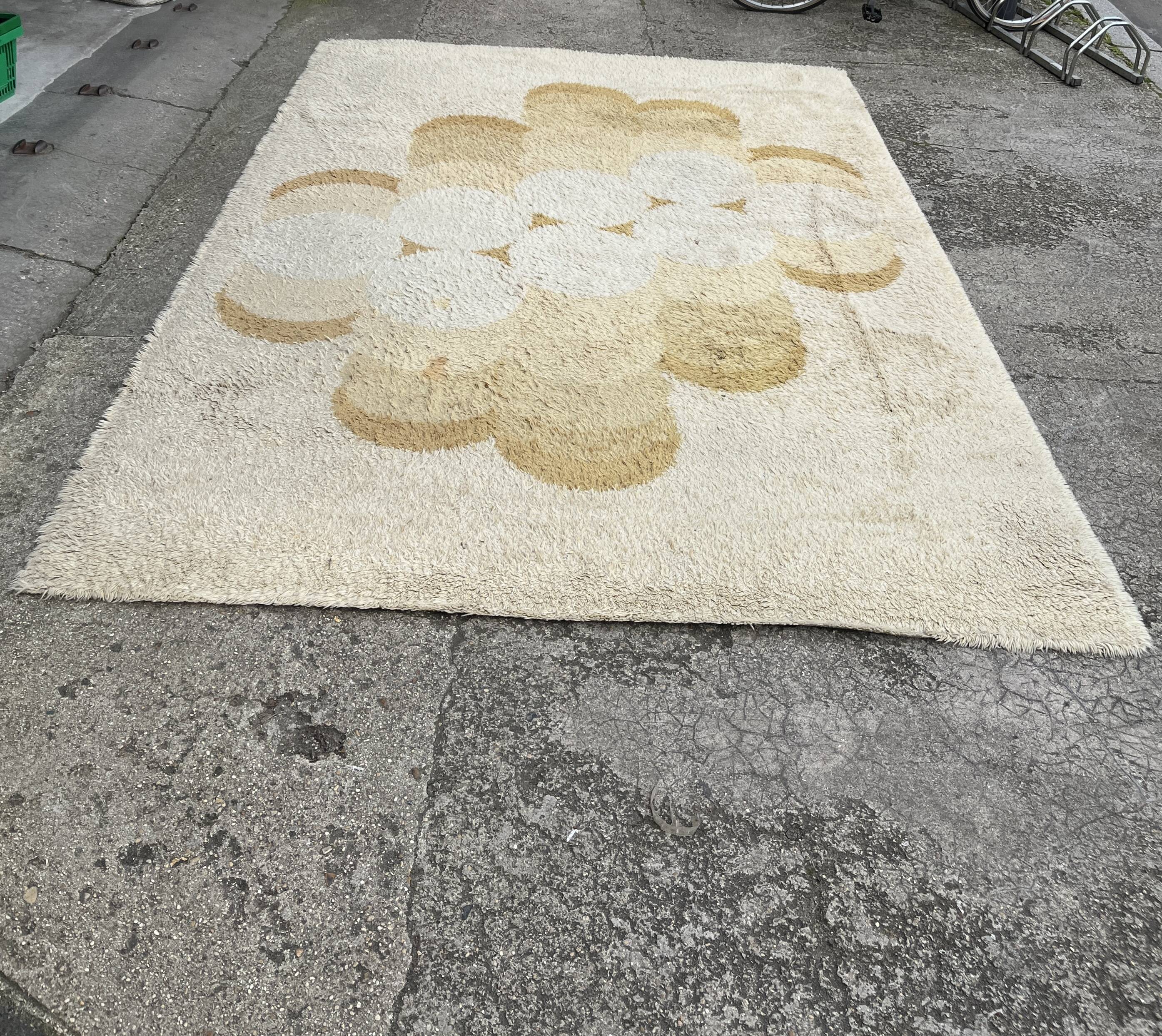 Large rug with floral decoration.